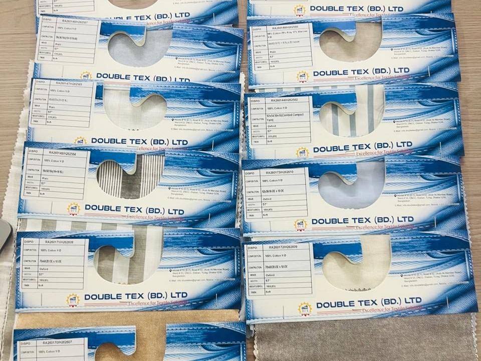 Double Tex fabric hanger cards, each with a woven swatch and a printed specification ticket